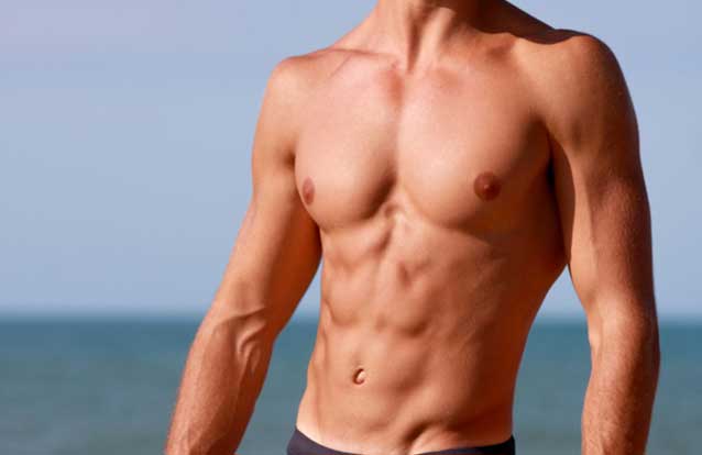 Man with abs after emsculpt treatment in Bay Area